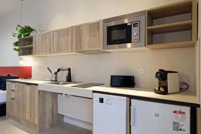 a kitchen with a sink and a microwave at Osito Hub - Colomer in Valencia