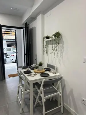 a white table and chairs in a room at Alojamiento,Hospedaje centrico en valencia in Valencia