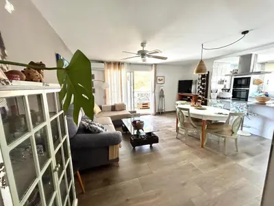 a living room with a couch and a table at Faro Playa de Cullera in Faro de Cullera