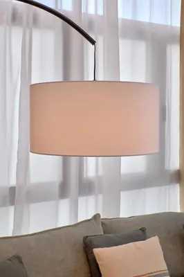 a lamp sitting next to a couch in front of a window at Romantic Suite Roig Arena N1 Virkin Suites in Valencia