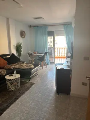 a living room with a couch and a table at Wohnung in Moncófar