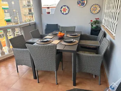 a dining room with a table and chairs at Wohnung in Moncófar