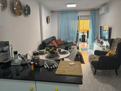 a living room with a couch and a table at Wohnung in Moncófar