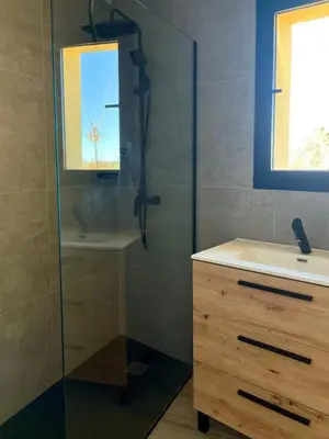 a bathroom with a glass shower and a sink at Elegante apartamento boutique a 5 min del metro in Bétera