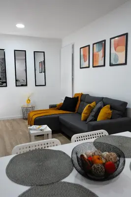 a living room with a couch and some tables at Zabas FLAT in Alboraya