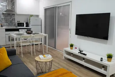 an empty hallway with white walls and wood floors at Zabas FLAT in Alboraya