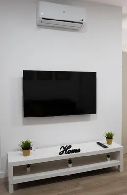 a living room with a tv on a white wall at Zabas FLAT in Alboraya
