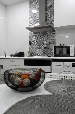 a bathroom sink with a faucet and a mirror at Zabas FLAT in Alboraya