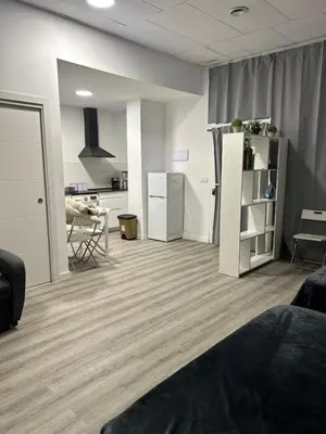 an empty room with a kitchen and a refrigerator at Alojamiento, hospedaje para 6 personas in Valencia