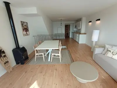 a living room with a white table and chairs at LOFT ROYAL - apartamento 