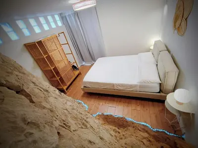 a living room with a bed and a couch at LOFT ROYAL - apartamento 