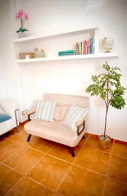 a bedroom with a blue bed with a white headboard at Casa Playa Moncofa in Moncófar