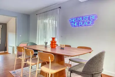 a dining room with a wooden table and chairs at Private Garden Villa near Valencia with Cinema and Gym in La Eliana