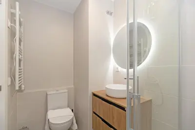 a bathroom with a toilet and a sink at GuestReady - Llovera apartments in Valencia
