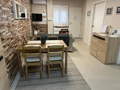 a living room with a table and a couch at Mi refugio en la playa in Moncófar