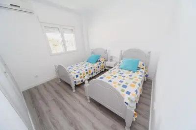 two twin beds in a white room with a window at Luxury villa 20 minutes from Valencia in Lliria