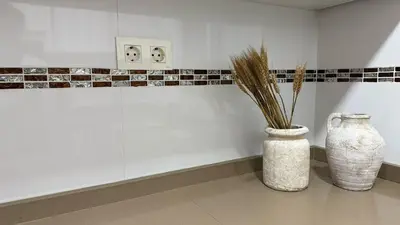 two white vases sitting on the floor in a room at Beach Room Valencia, NETFLIX, 4 mins walk to the beach in Valencia