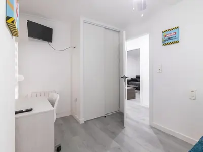 a white room with a kitchen and a living room at Winahost Paterna Palisses in Paterna