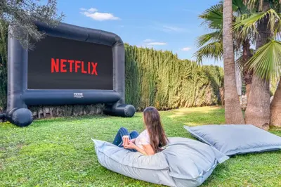 a girl sitting on a bean bag chair in front of a sign at Villa near Valencia 17PAX, Pool, Cinema, BBQ, KidsRoom in Manises