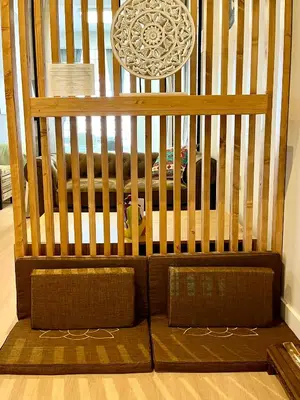 a crib with two pillows in a room at Encantador apartamento boutique a 5 min del metro in Bétera