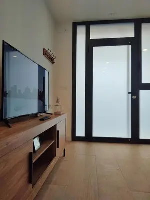 a living room with a large flat screen tv at New central flat with AC and Wifi in Valencia