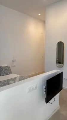 a bathroom with a shower with a toilet and a sink at MAGNO- Beach in Valencia