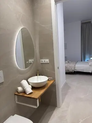 a bathroom with a toilet and a sink and a shower at MAGNO- Beach in Valencia