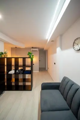 a living room with a couch and a bed at Accommodation for 4 people in Valencia