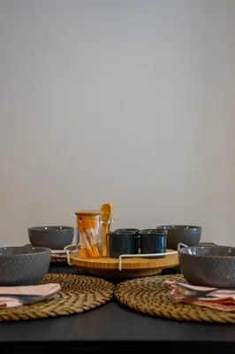 a table with bowls and cups on a tray at Accommodation for 4 people in Valencia