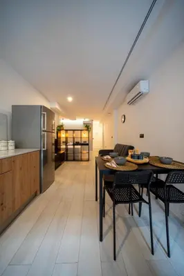a kitchen and living room with a table and chairs at Accommodation for 4 people in Valencia