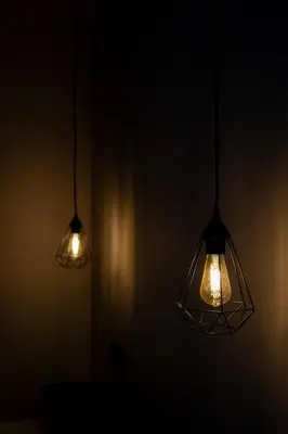 two lights are hanging in a dark room at Accommodation for 4 people in Valencia
