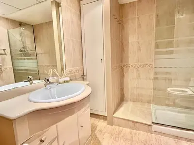 a bathroom with a sink and a shower at Complejo de playa in Valencia