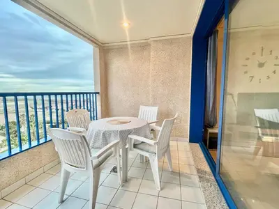 a table and chairs on a balcony with a view at Complejo de playa in Valencia