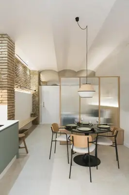 a dining room with a table and chairs at FLORIT FLATS - Estudio de Diseño en el Corazón de Ruzafa in Valencia