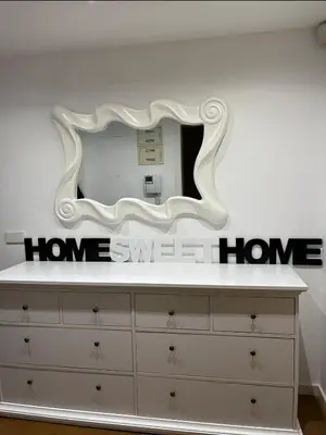 a mirror on top of a dresser in a room at HomeSweetHome Valencia in Valencia