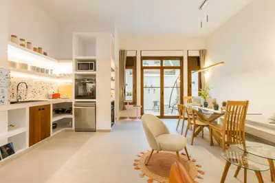 a kitchen and dining room with a table and chairs at SeaFront Casa Valencia in Valencia
