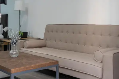 a living room with a couch and a coffee table at VLC HOST - Oriente in Valencia