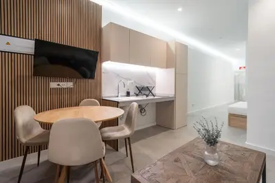 a kitchen and dining room with a table and chairs at VLC HOST - Oriente in Valencia