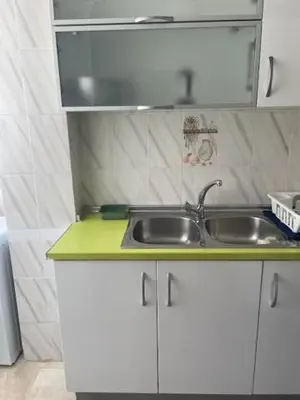 a bathroom with a white sink and a shower at Tranquila, Céntrica y Luminosa Habitación de Matrimonio en Vivienda Compartida in Valencia