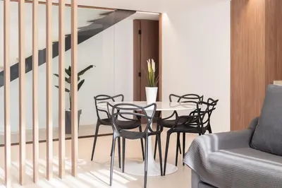 a dining room with a table and chairs at Aqua Suites Ciudad de las Artes I in Valencia
