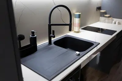 a kitchen with a sink with a faucet at Charming Urban Stay in Valencia in Valencia