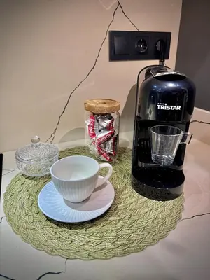 a coffee maker and a cup on a table at Charming Urban Stay in Valencia in Valencia