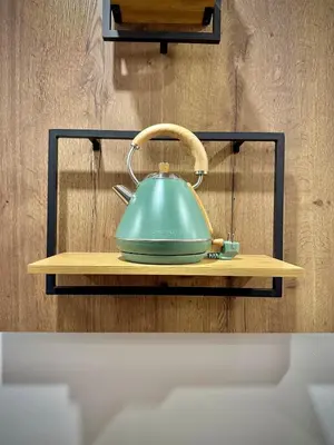 a teapot on a wooden shelf on a wall at Charming Urban Stay in Valencia in Valencia