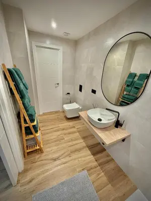 a bathroom with a sink and a mirror at Charming Urban Stay in Valencia in Valencia