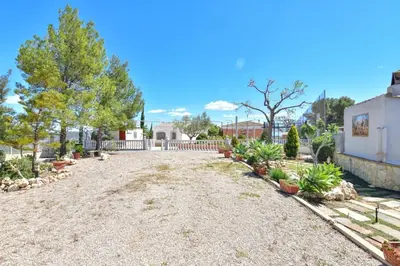 a driveway of a home with trees and plants at Exclusive Villa in Catadau: Pool & Private Gardens in Catadau
