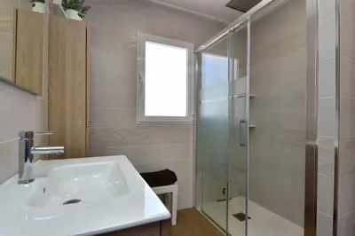 a bathroom with a sink and a shower at Exclusive Villa in Catadau: Pool & Private Gardens in Catadau