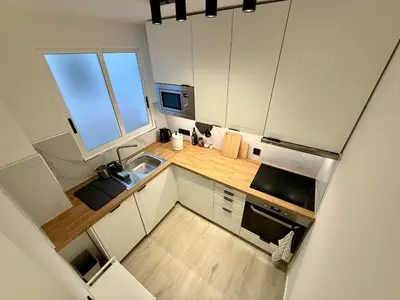 an overhead view of a kitchen with a sink and a microwave at Cómodo Apartamento cerca de la playa de San Antonio, dos baños in Cullera