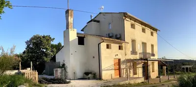 an old building with a tower on top of it at Hort de les Oronetes in Alzira