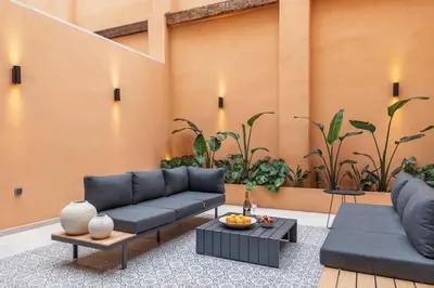 a living room with a couch and tables and plants at SariStays Valencia Luxe Touch in Valencia