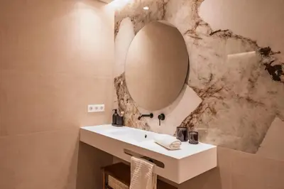 a bathroom with a sink and a mirror at SariStays Valencia Luxe Touch in Valencia